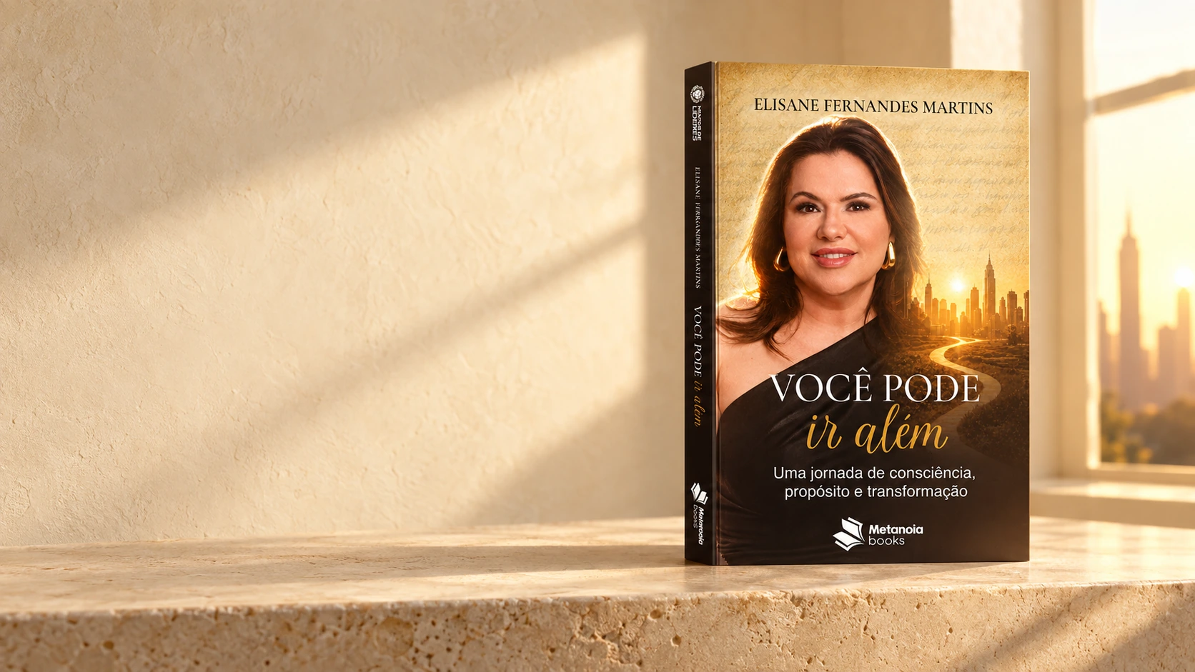 Livro Você pode ir além apoiado em uma bancada de pedra, junto à luz dourada de uma janela.